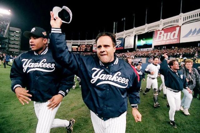 New York Yankees manager Joe Torre celebrates his team's World Series victory.